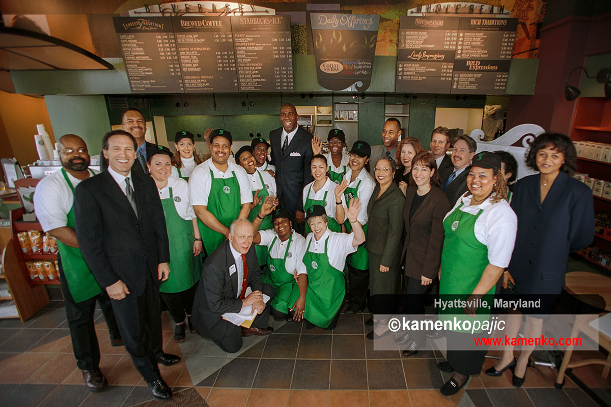 Howard Schultz, chairman and CEO of Starbucks Coffee Company, left, and NBA great, Earvin Magic Johnson with a stuff