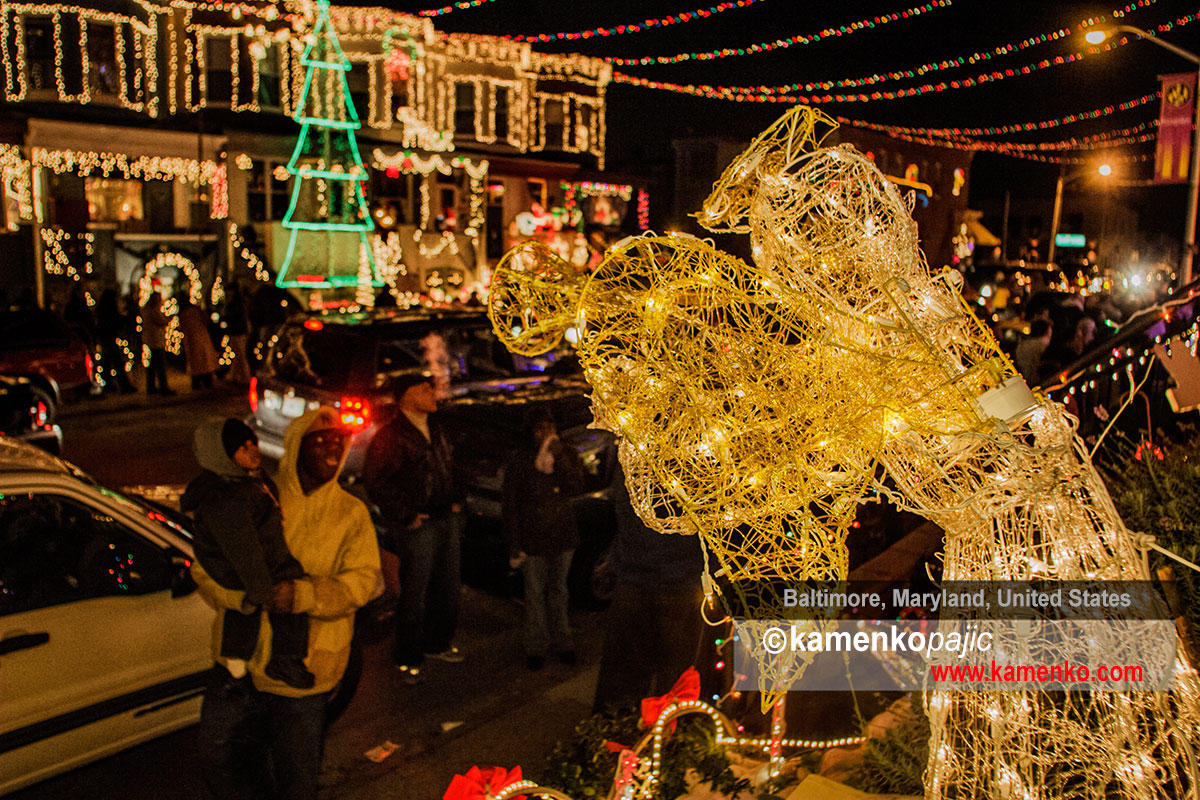 Citizens admire holiday lights and decorations along the 700 block of 34th street