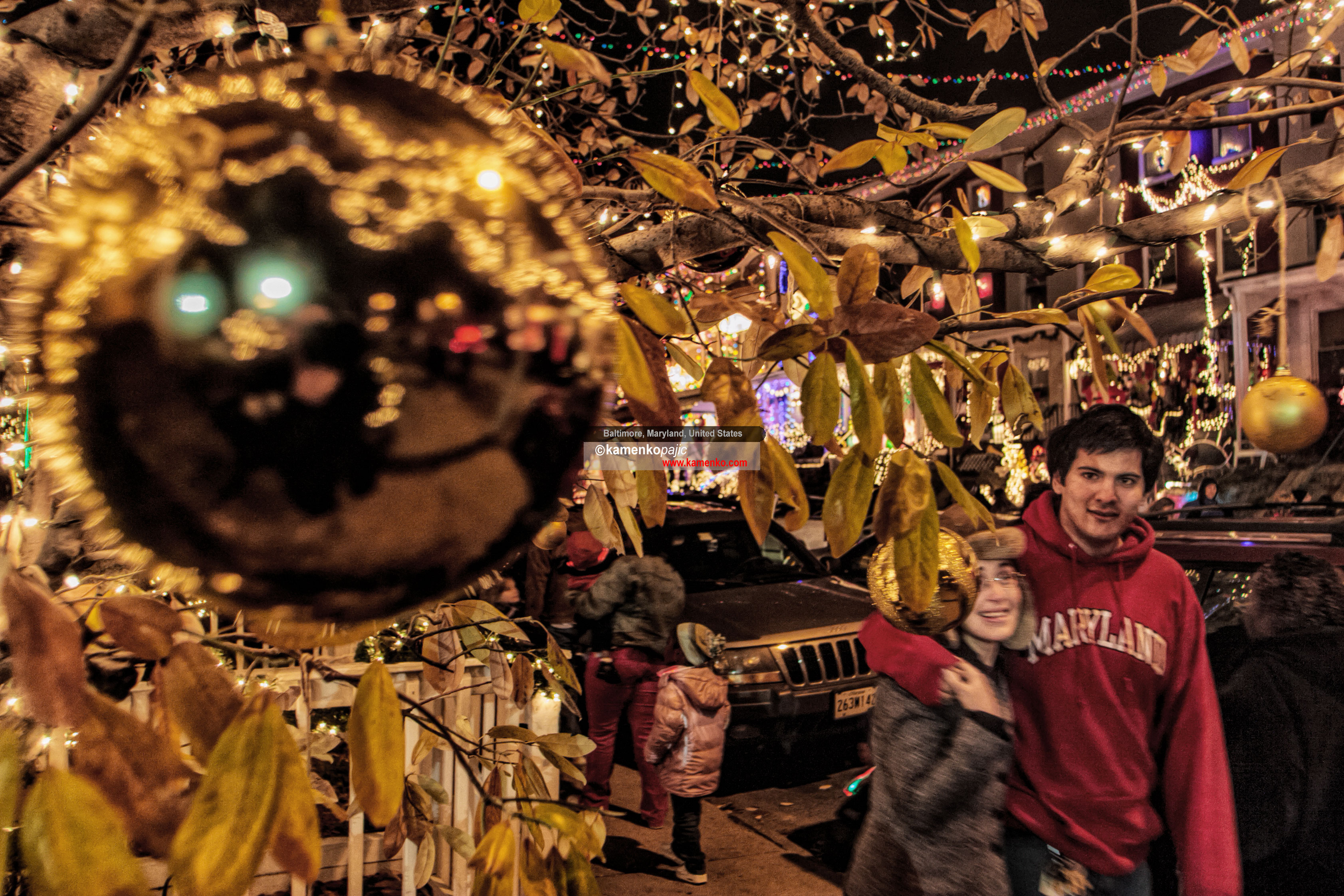 A curious boy examines an extravagantly decorated porch