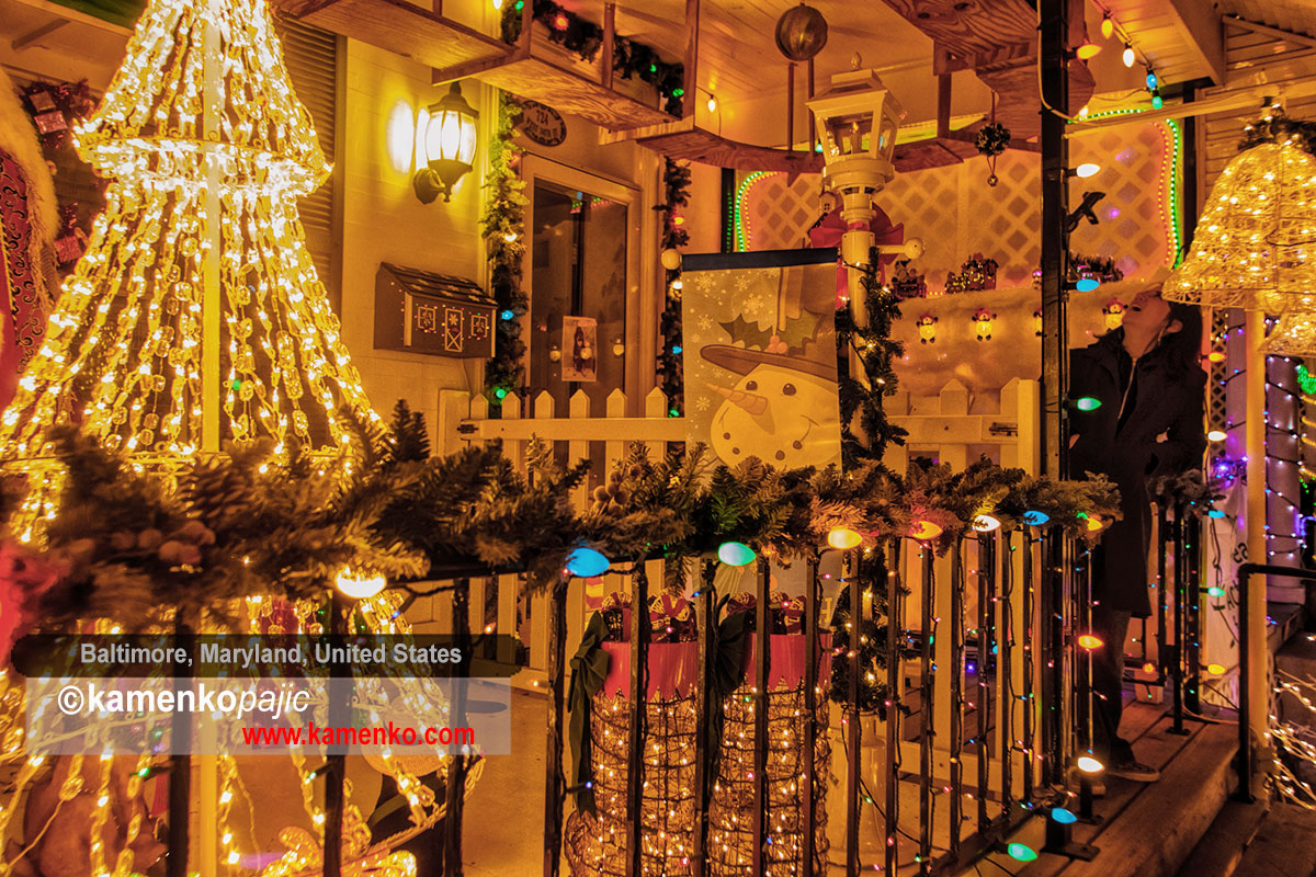 Visitor admire a front porch with holiday decorations along the 700 block of 34th street