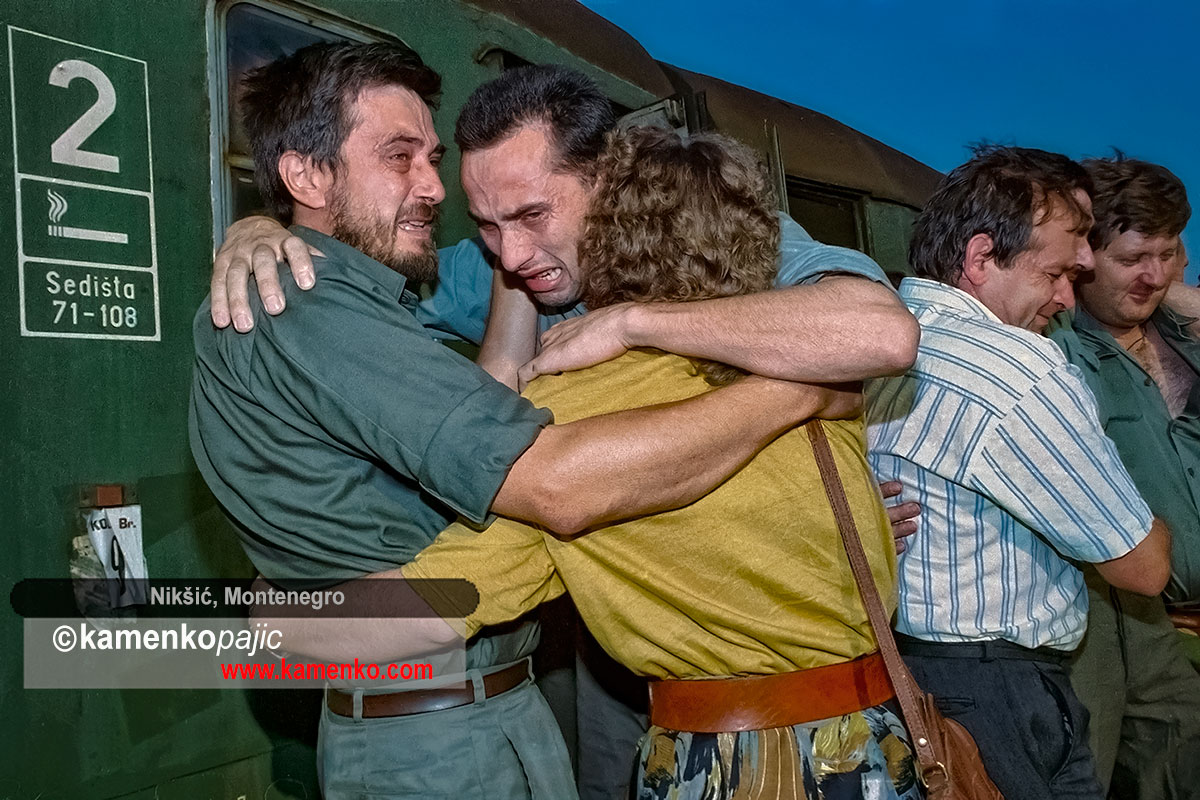 Family members welcome a soldier after his release from a prison camp
