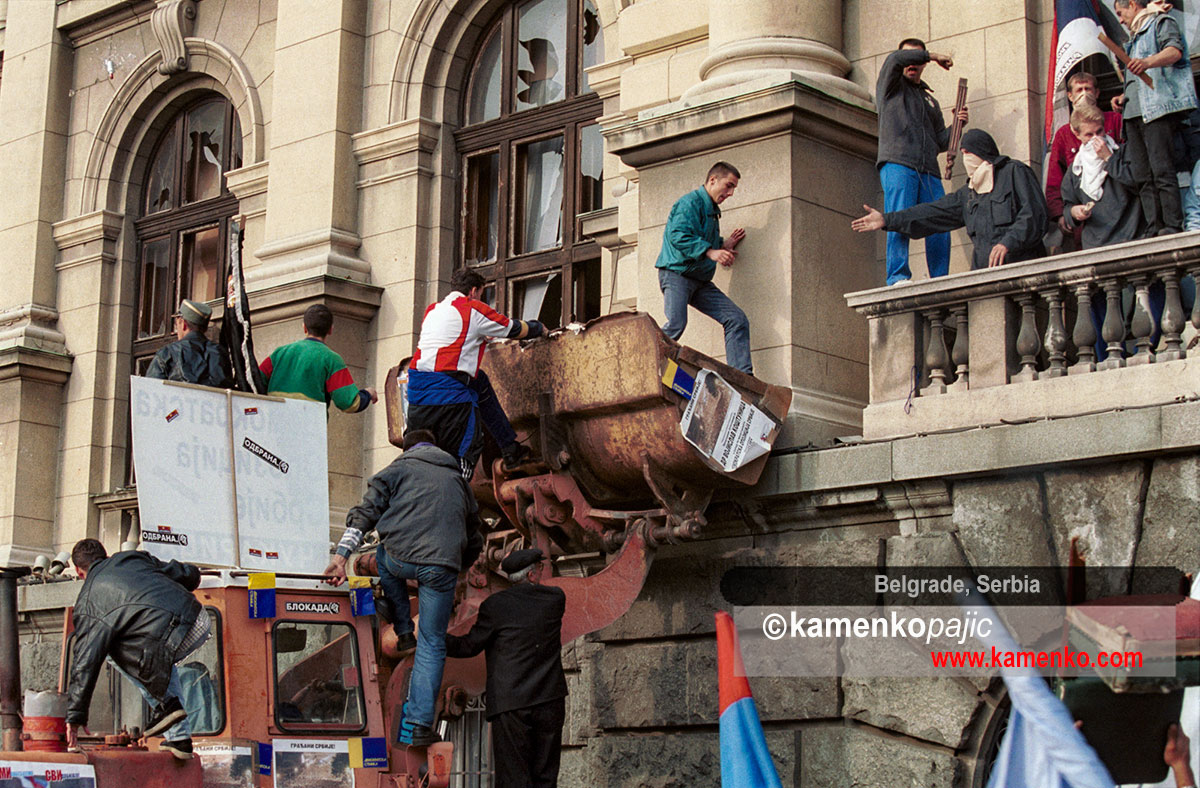 Protesters use frontloader to storm Parliament building